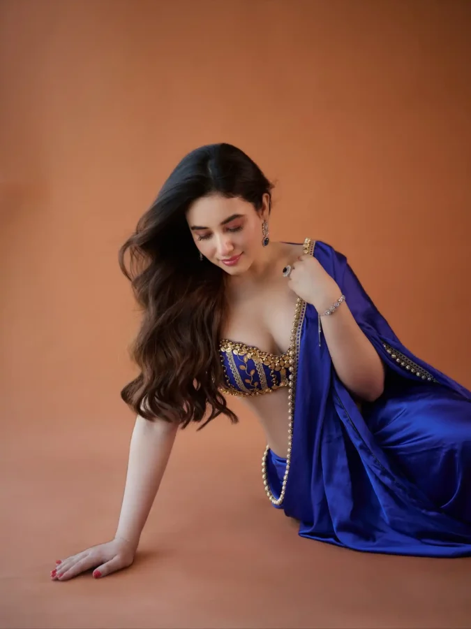 Aditi Budhathoki Flaunts Deep Neck Blouse In Blue Saree