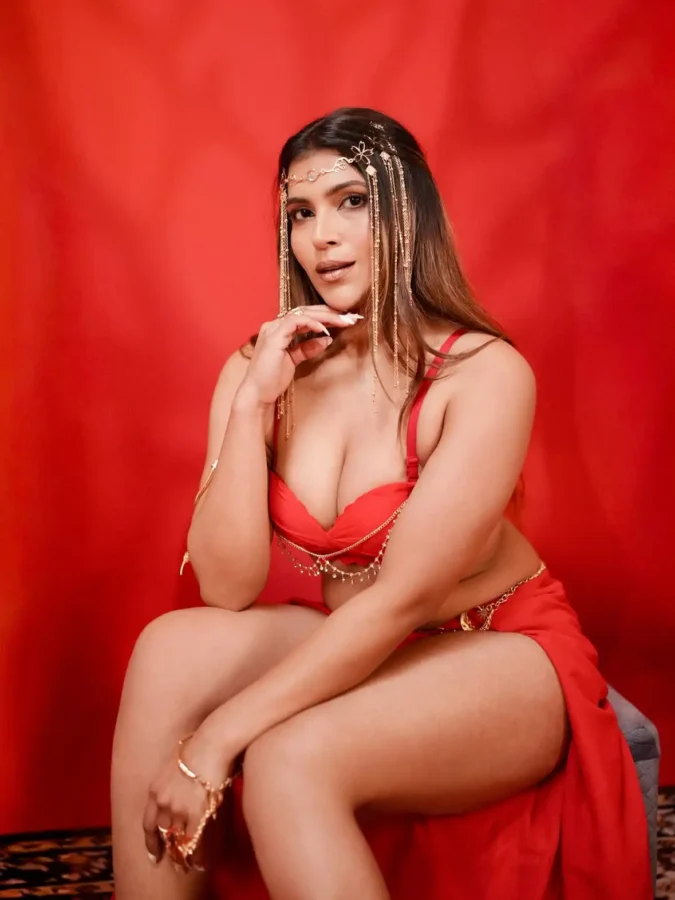 Tanya Chaudhari's deep cleavage in Red bralette 1