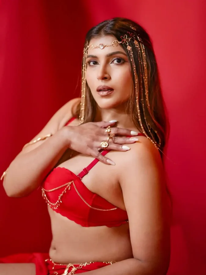 Tanya Chaudhari's deep cleavage in Red bralette 6