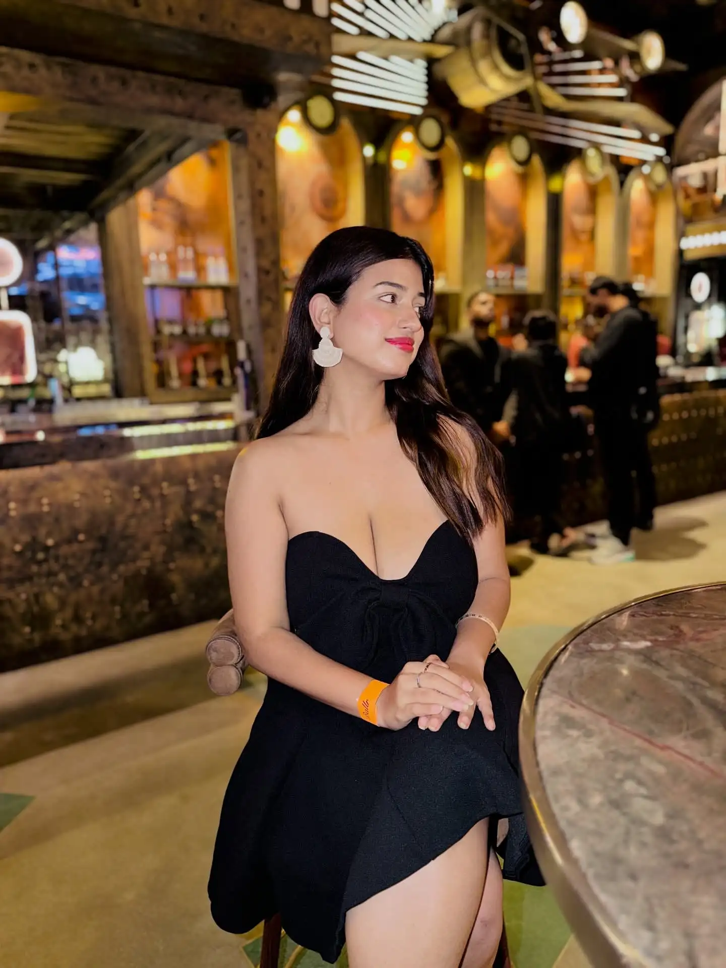 Tushikha Goswami Flaunts Deep Cleavage In Black Strapless Mini Dress
