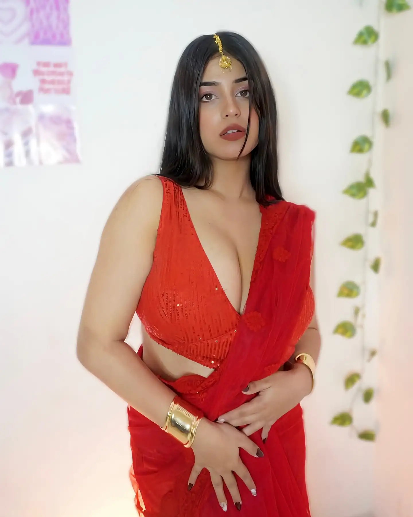 Tushikha Goswami Flaunts Deep Cleavage In Bold Red Saree Look