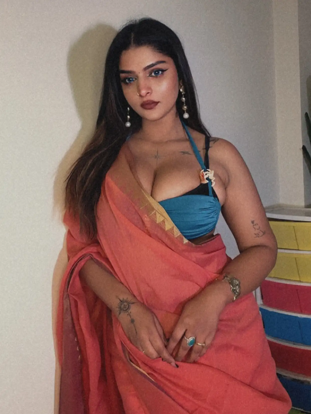 Vinni Varsha Chitara Drops A Sultry Desi Glam Look In A Daring Orange Saree And Teal Blouse