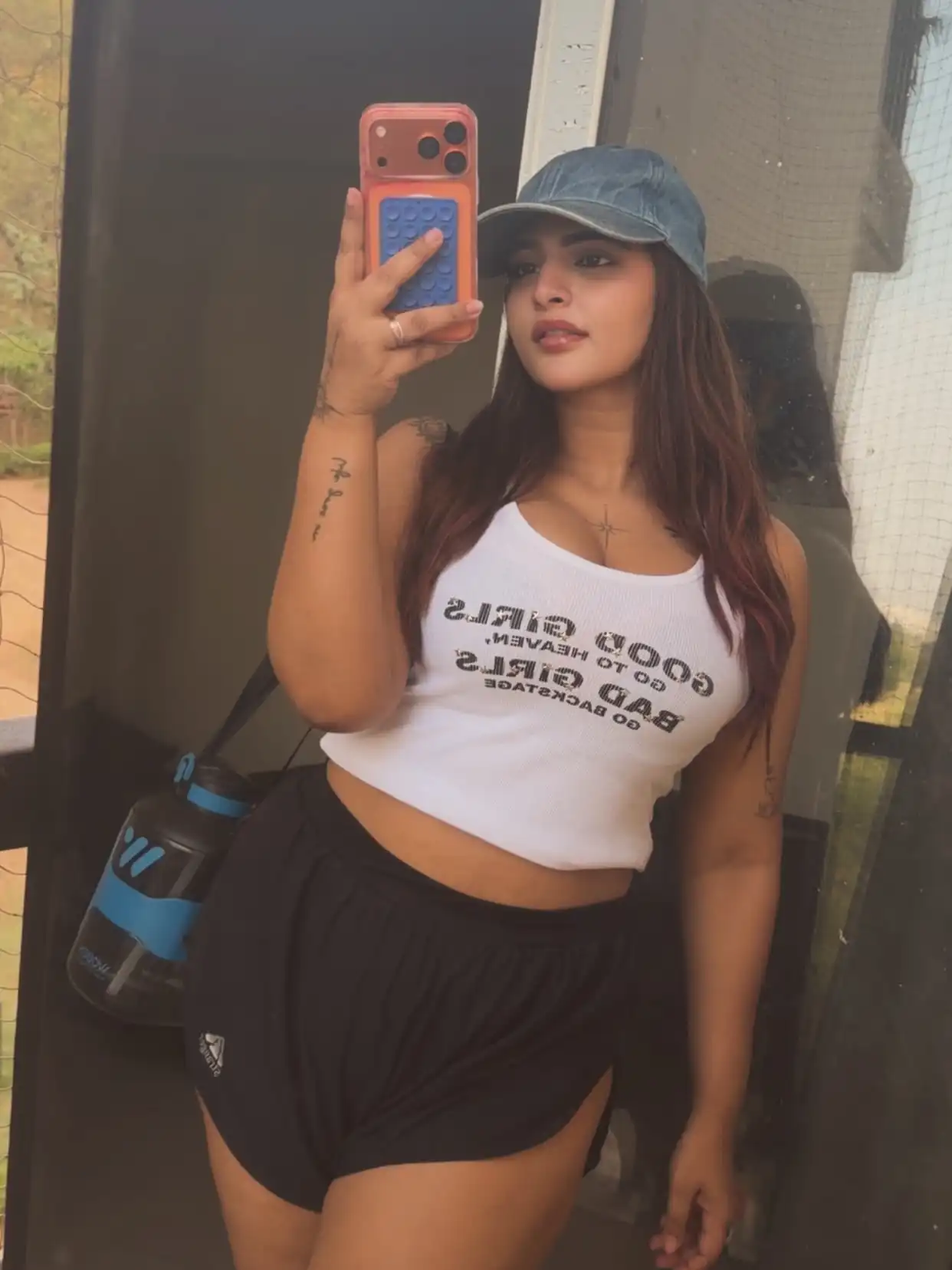 Vinni Varsha Chitara Flaunts Her Cleavage And Thick Thighs In A Sporty White Crop Top And Black Shorts