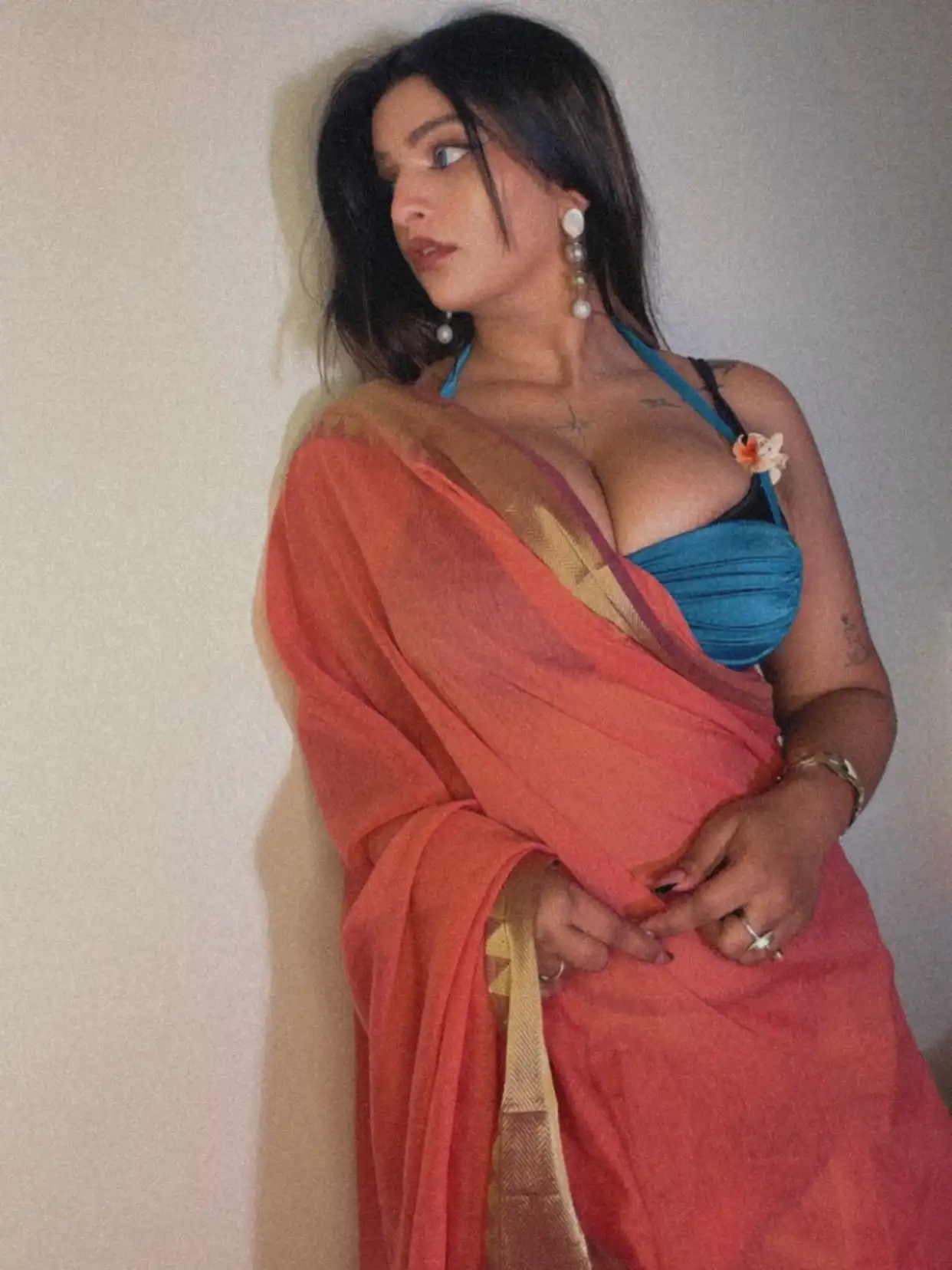 Vinni Varsha Chitara Flaunts Her Curves And Cleavage In A Sheer Orange Saree With Bold Blouse Look
