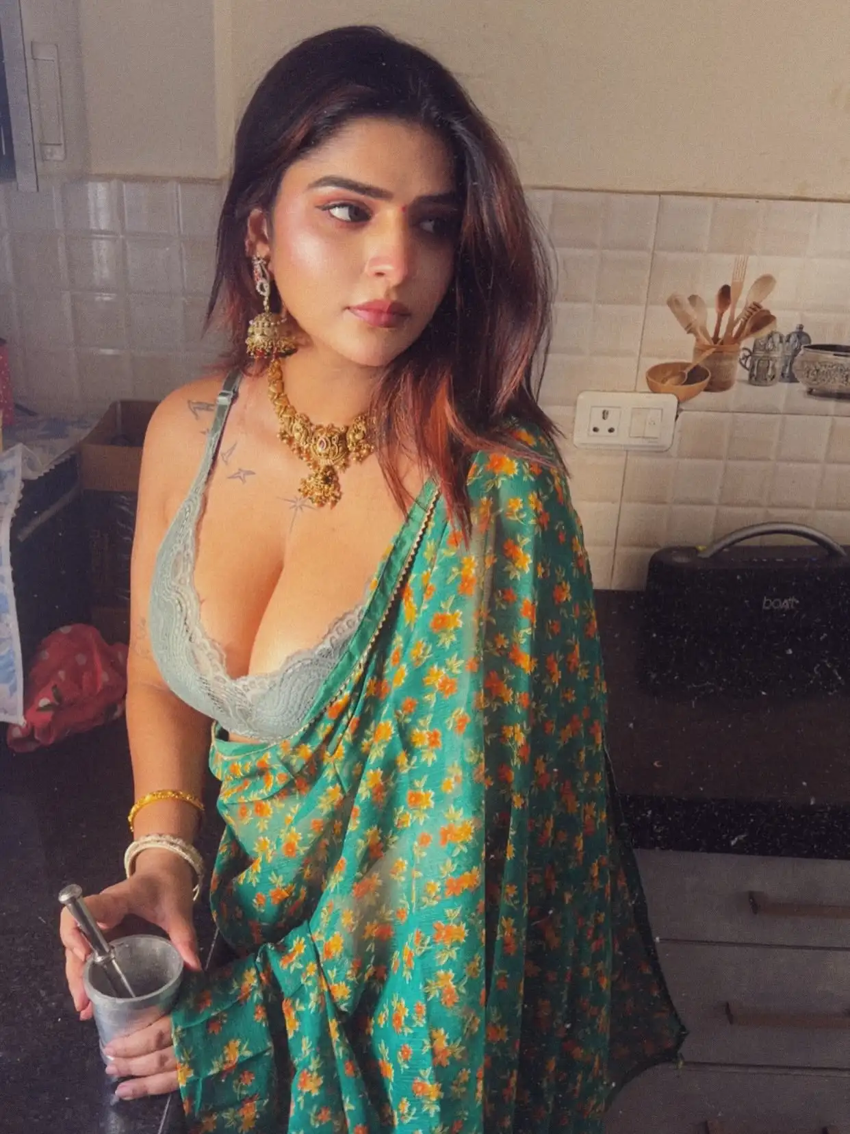 Vinni Varsha Chitara Flaunts Her Deep Cleavage In A Floral Saree And Lace Bralette Look